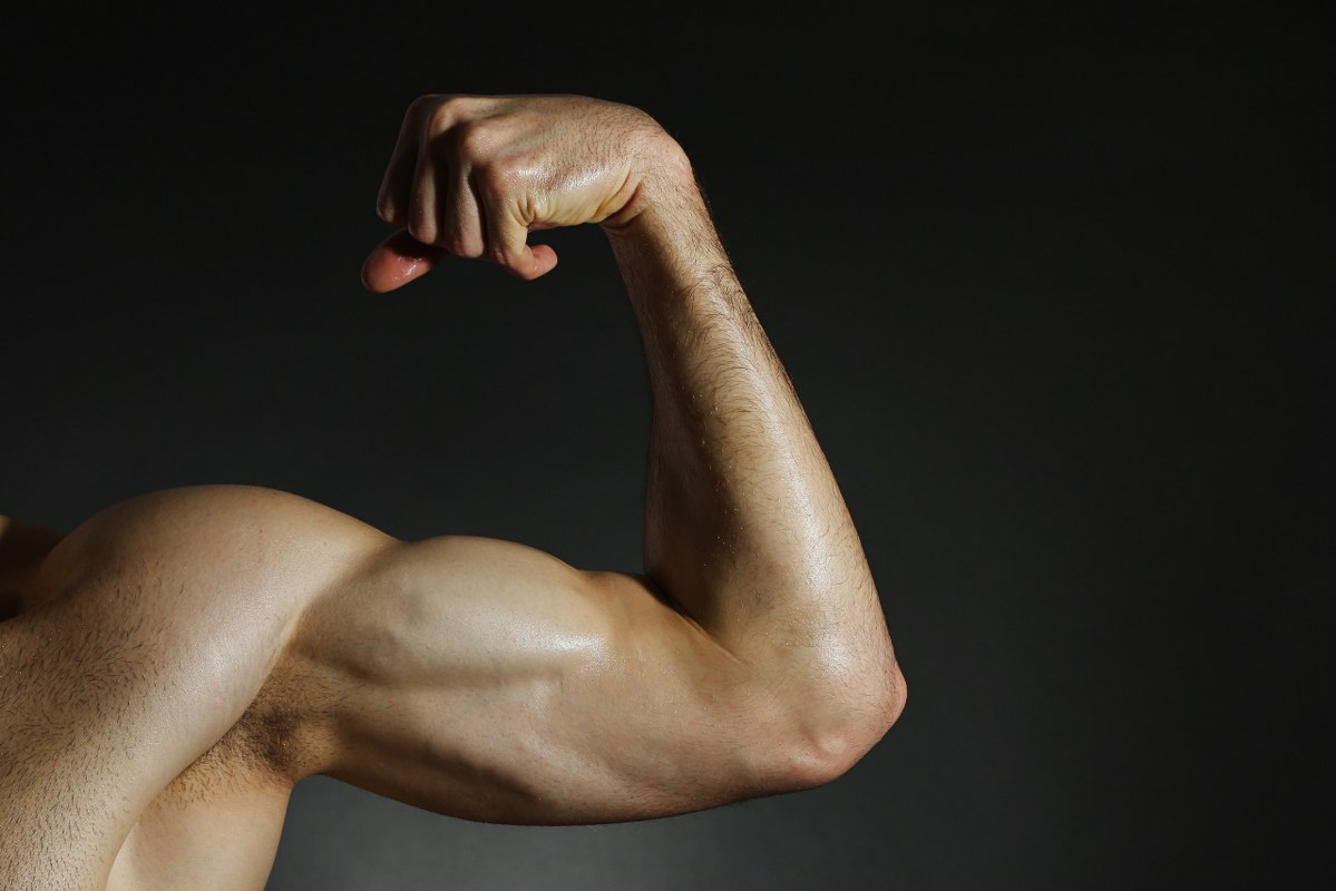 Person Flexing Muscular Arm showing one side only.