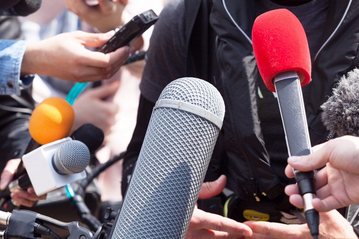 Person being interviewed by media.