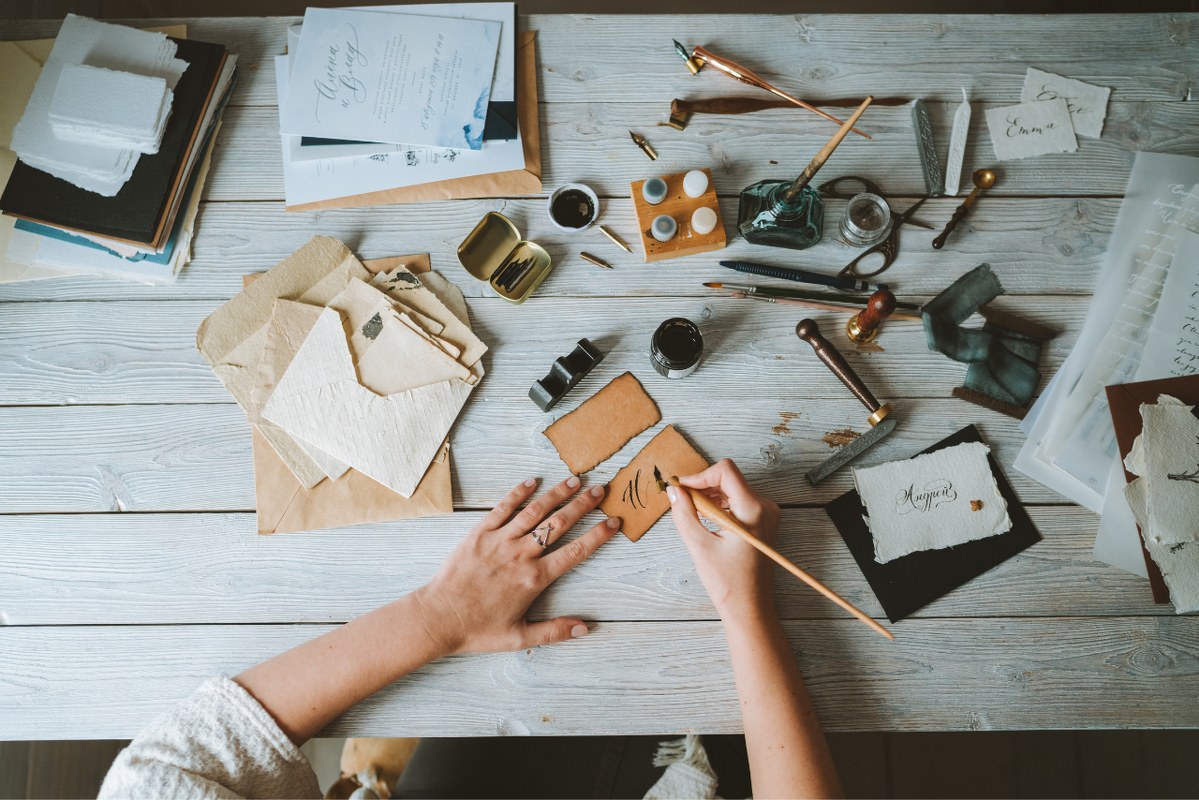 Person doing calligraphy.