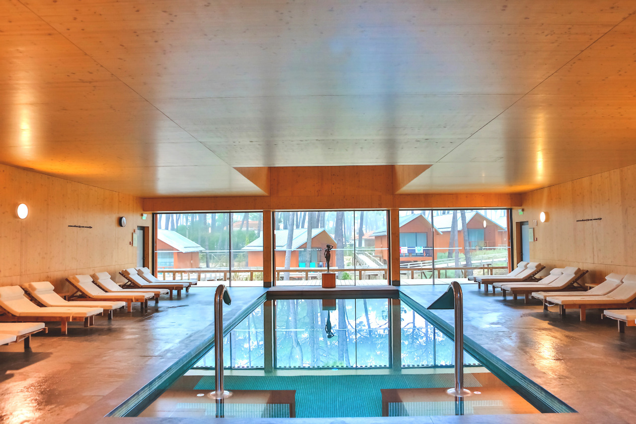 Resort spa with pool inside hotel.