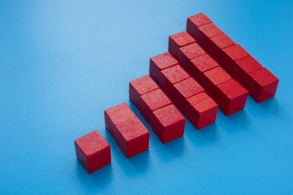 Scalability concept: A Pyramid from red cubes.