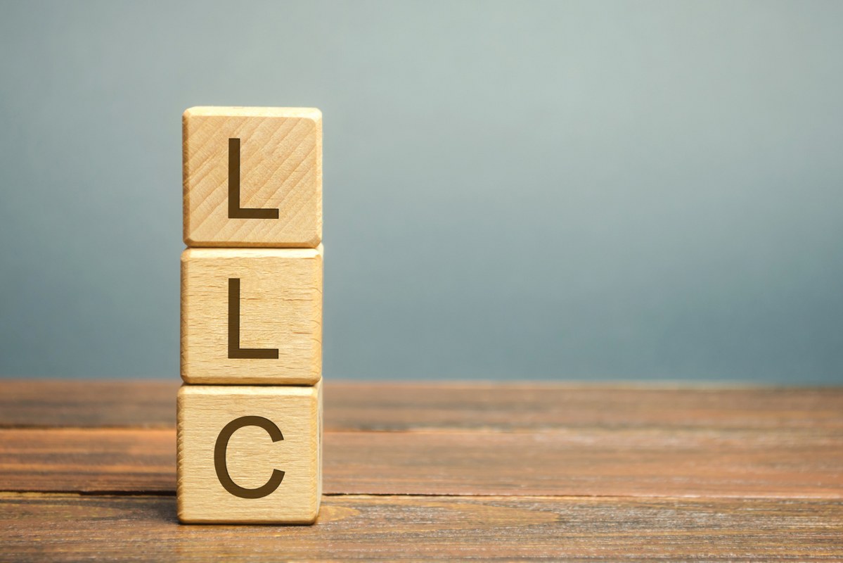 Scrabble blocks stacked upwards forming LLC.