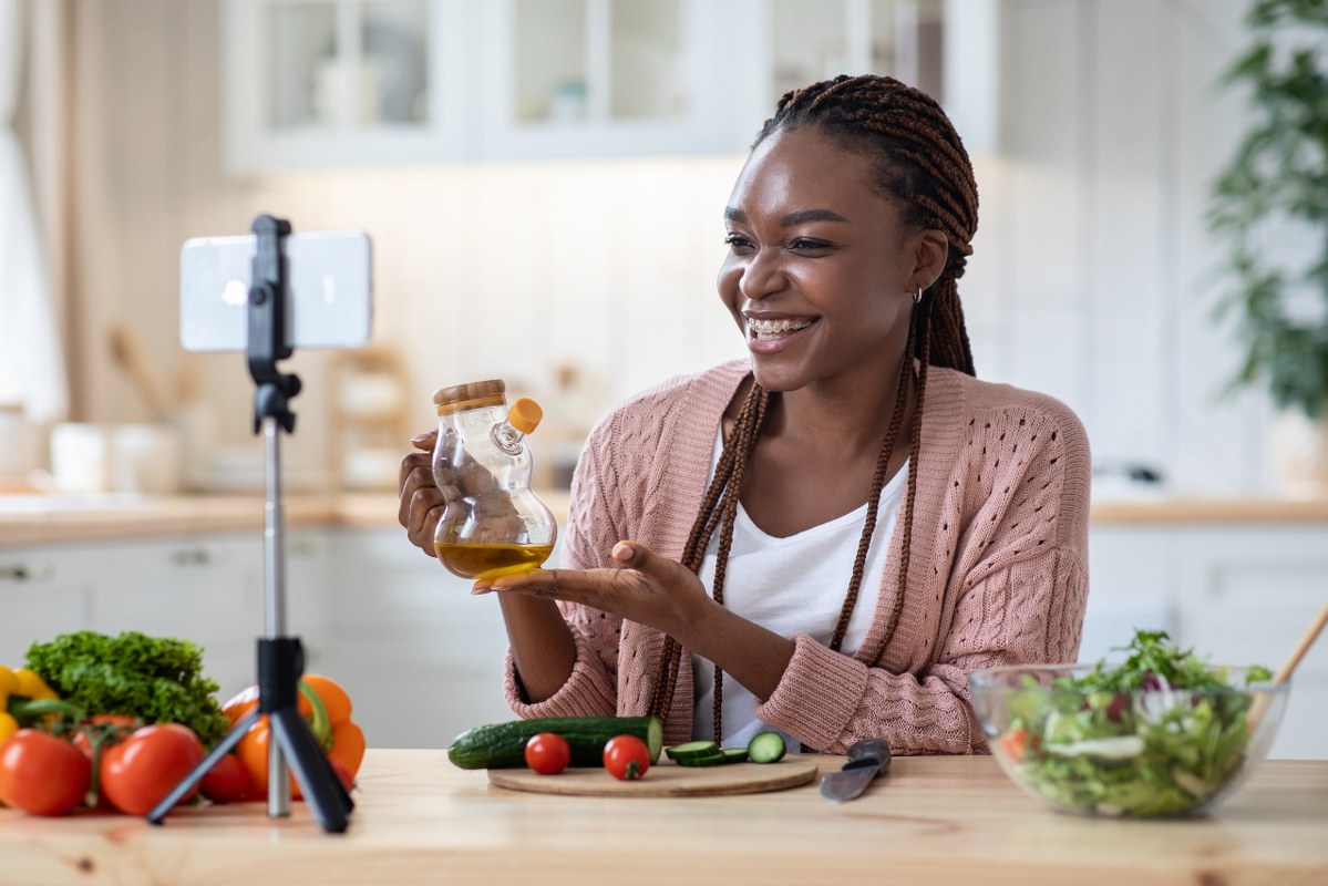 Smiling Nutrition Coach Lady Recording Video Recipe In Kitchen.