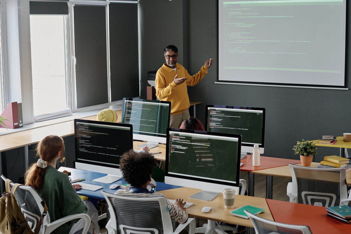 Teacher and students in Computer Science Class.