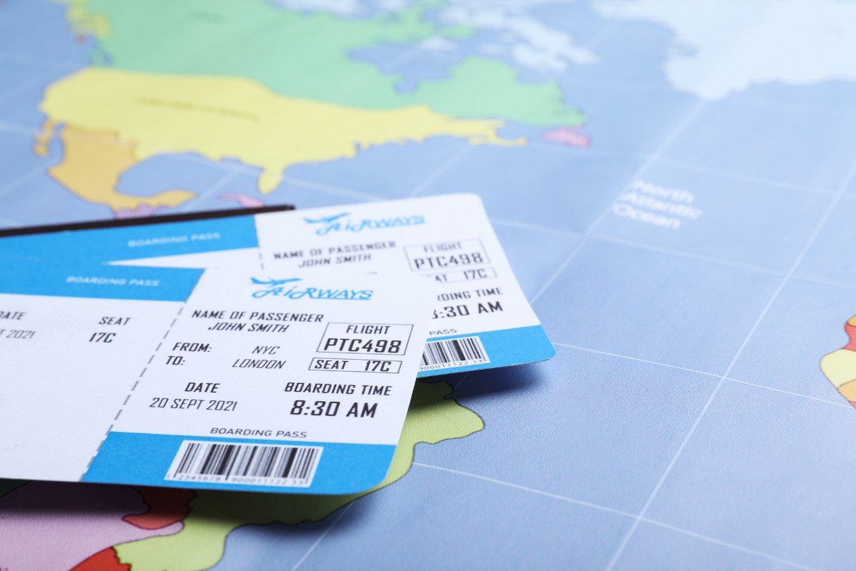Tourism Agency Concept: Tickets on World Map.