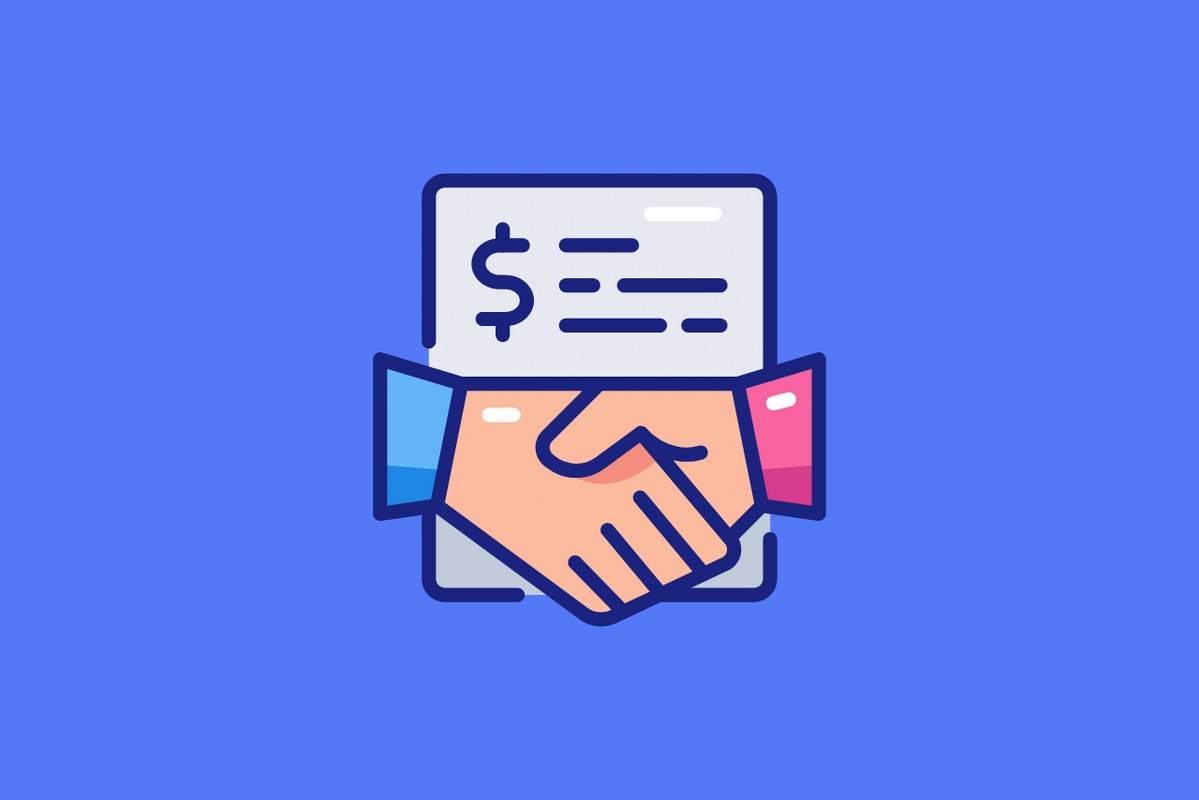 Two hands shaking to symbolize a partnership, with a dollar sign written on a piece of paper nearby.
