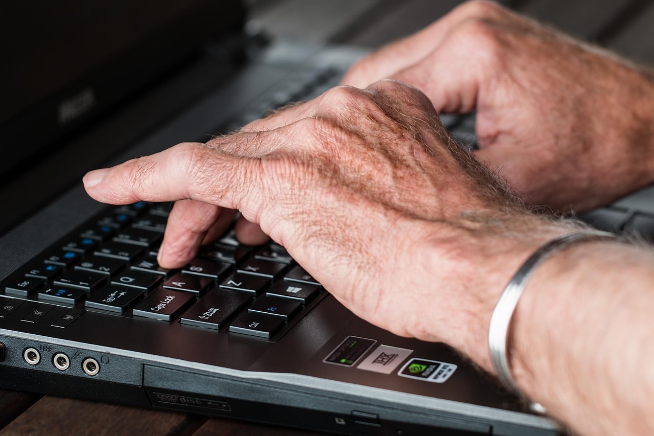 Typing on a laptop.