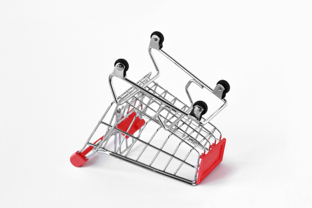 Upside-down shopping cart on a white background.