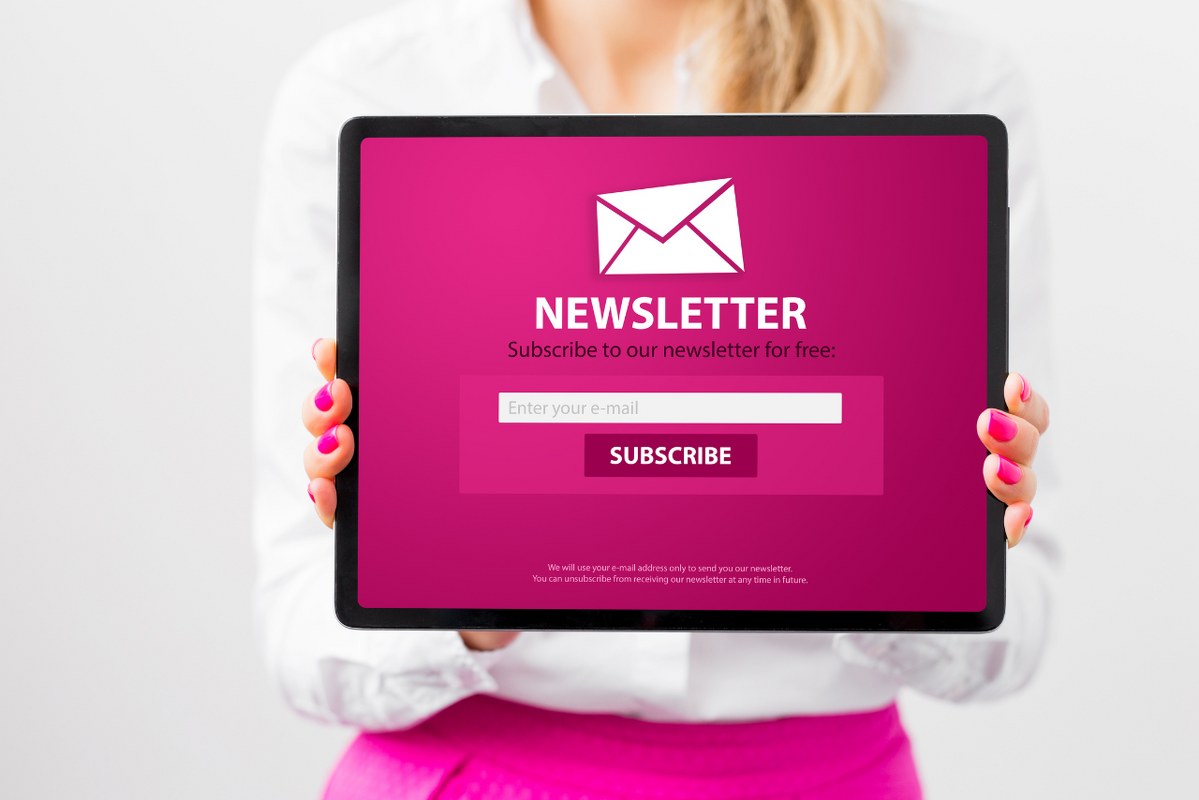 Woman Showing Tablet with Newsletter Signup membership Page.