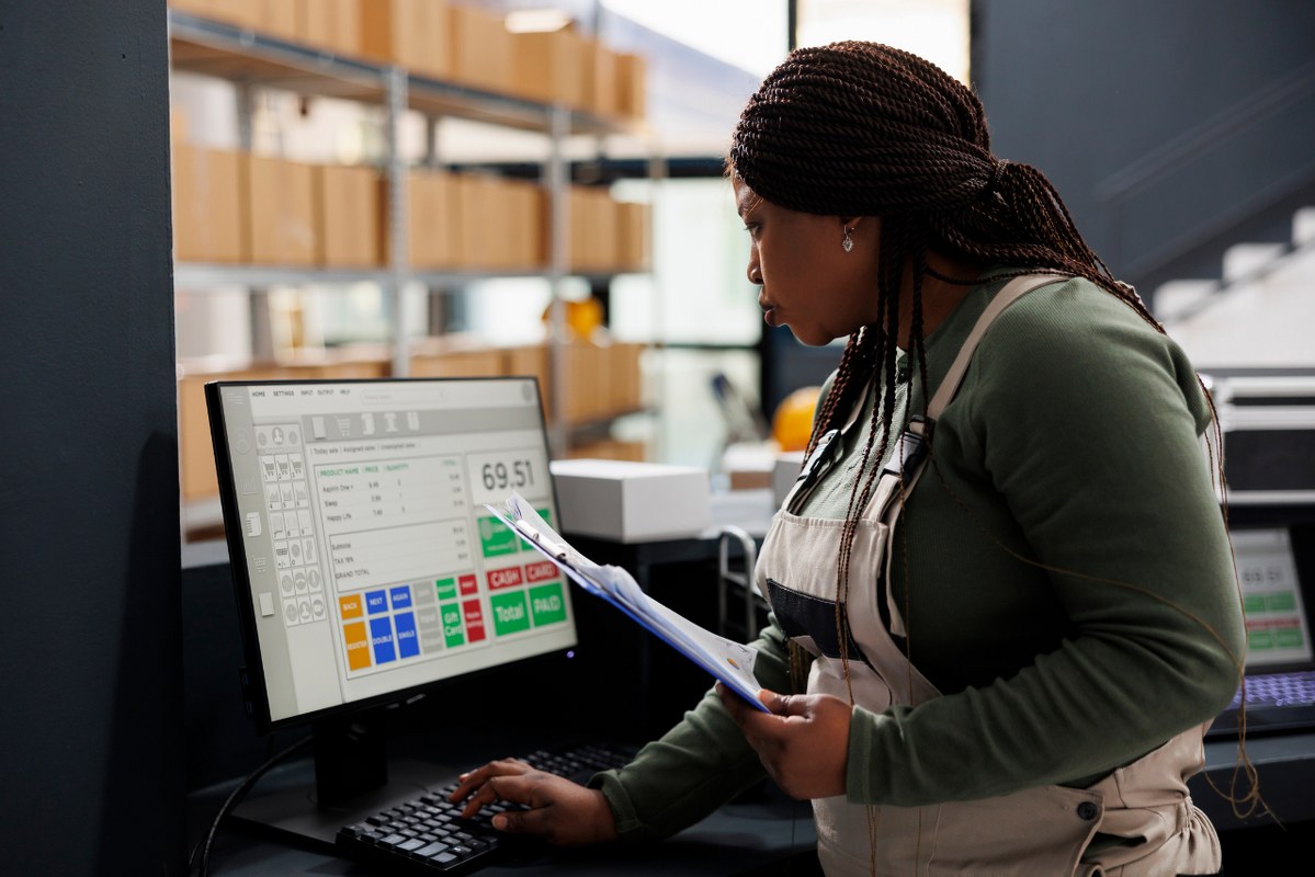 Worker Looking at a Low Inventory Report.