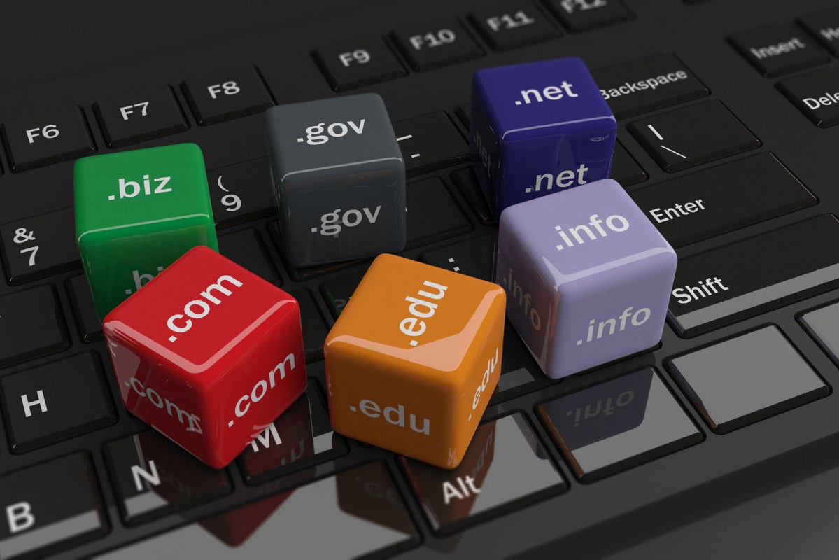 3d rendering cubes with domain names on a keyboard.