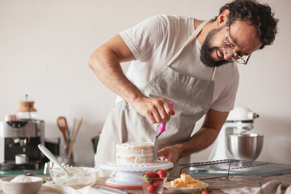 A Baker Making a Cake in a Kitchen.