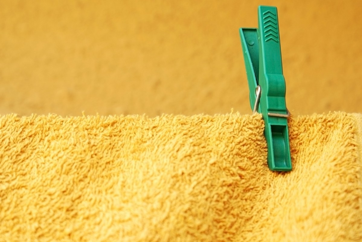 A green Beach Towel Clip.