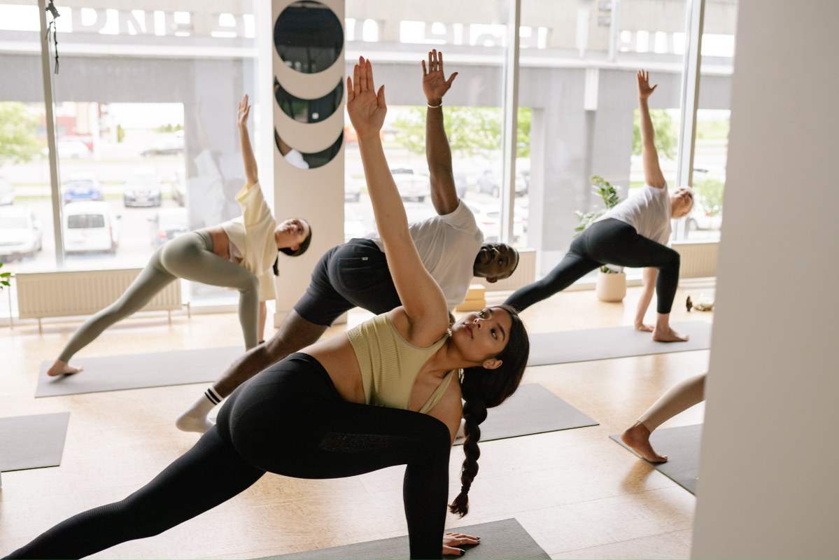 A group of people participating in a yoga class.