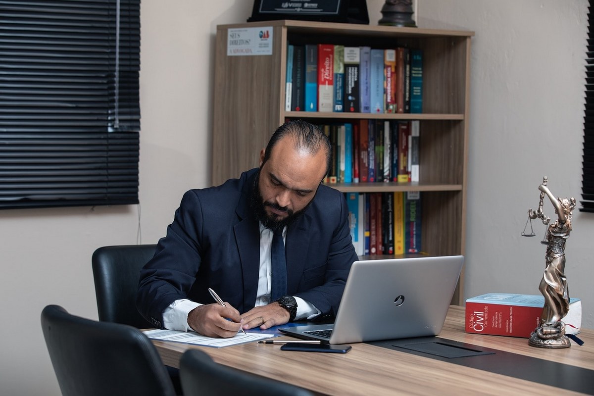 A lawyer doing paperwork at his desk.