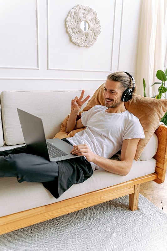 A man listening to a virtual event.