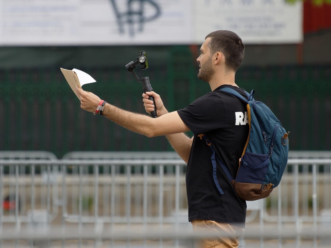 A man recording himself live.