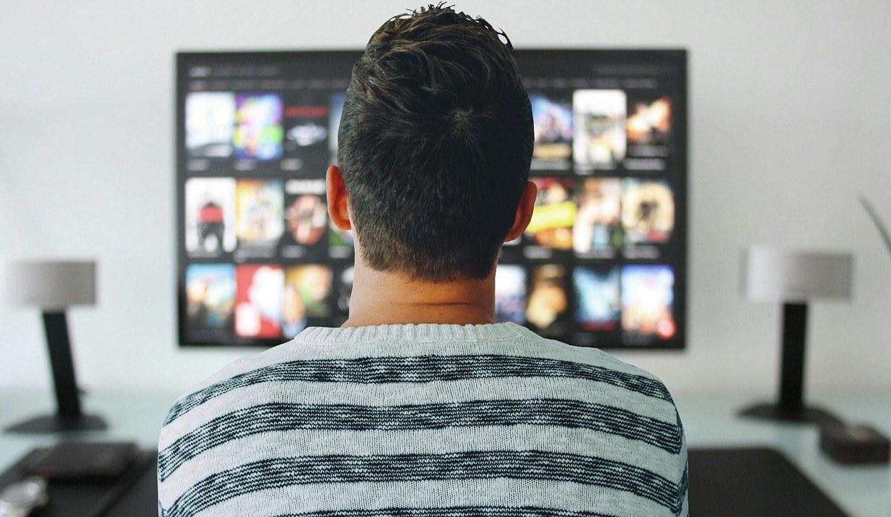 A man watching videos.