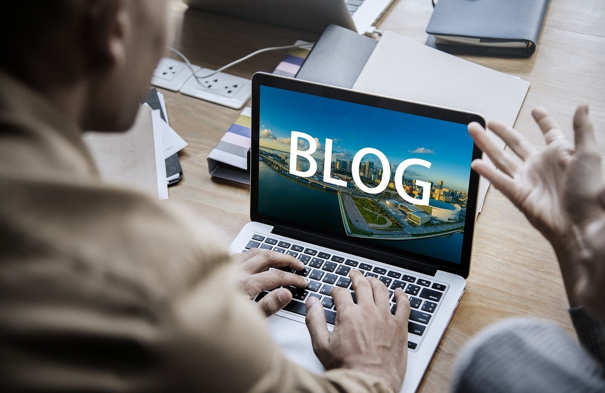 A man writing a social media blog.