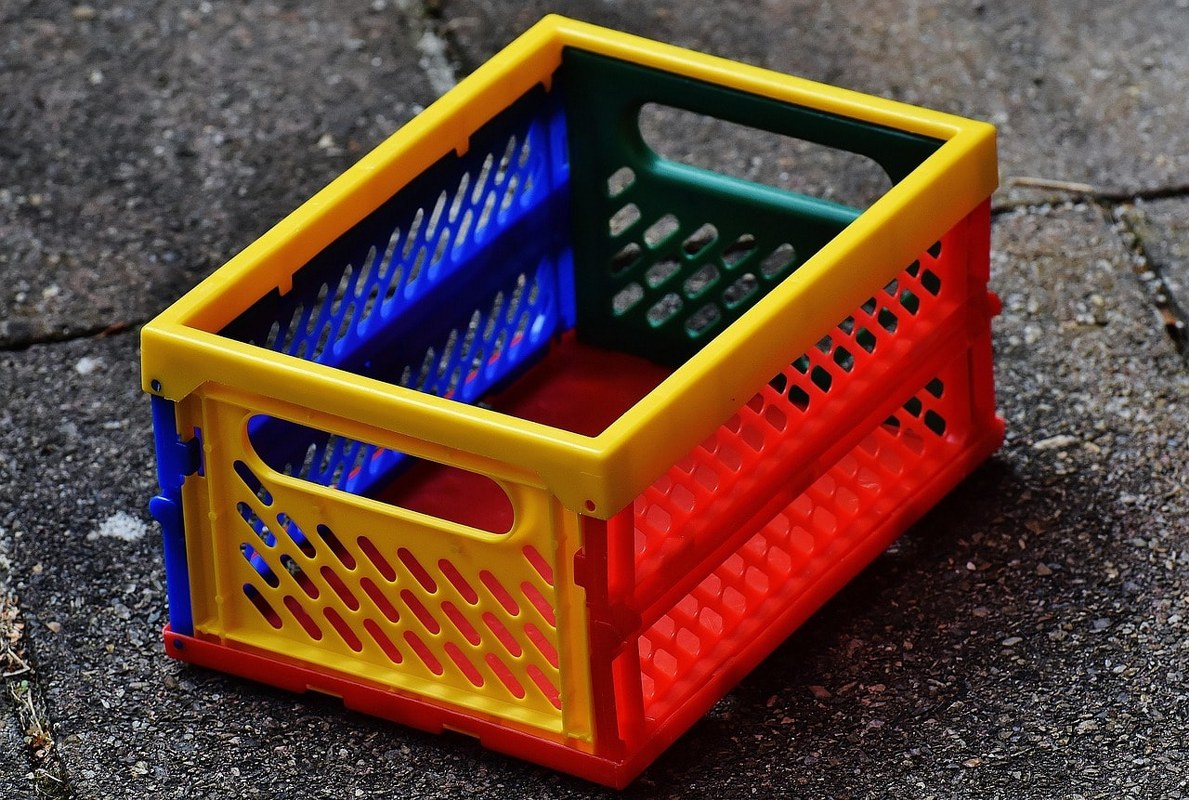 A plastic storage box for cards.