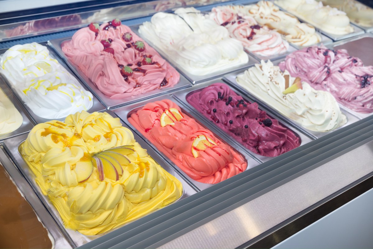 A scoop of ice cream served in a ice cream parlor.