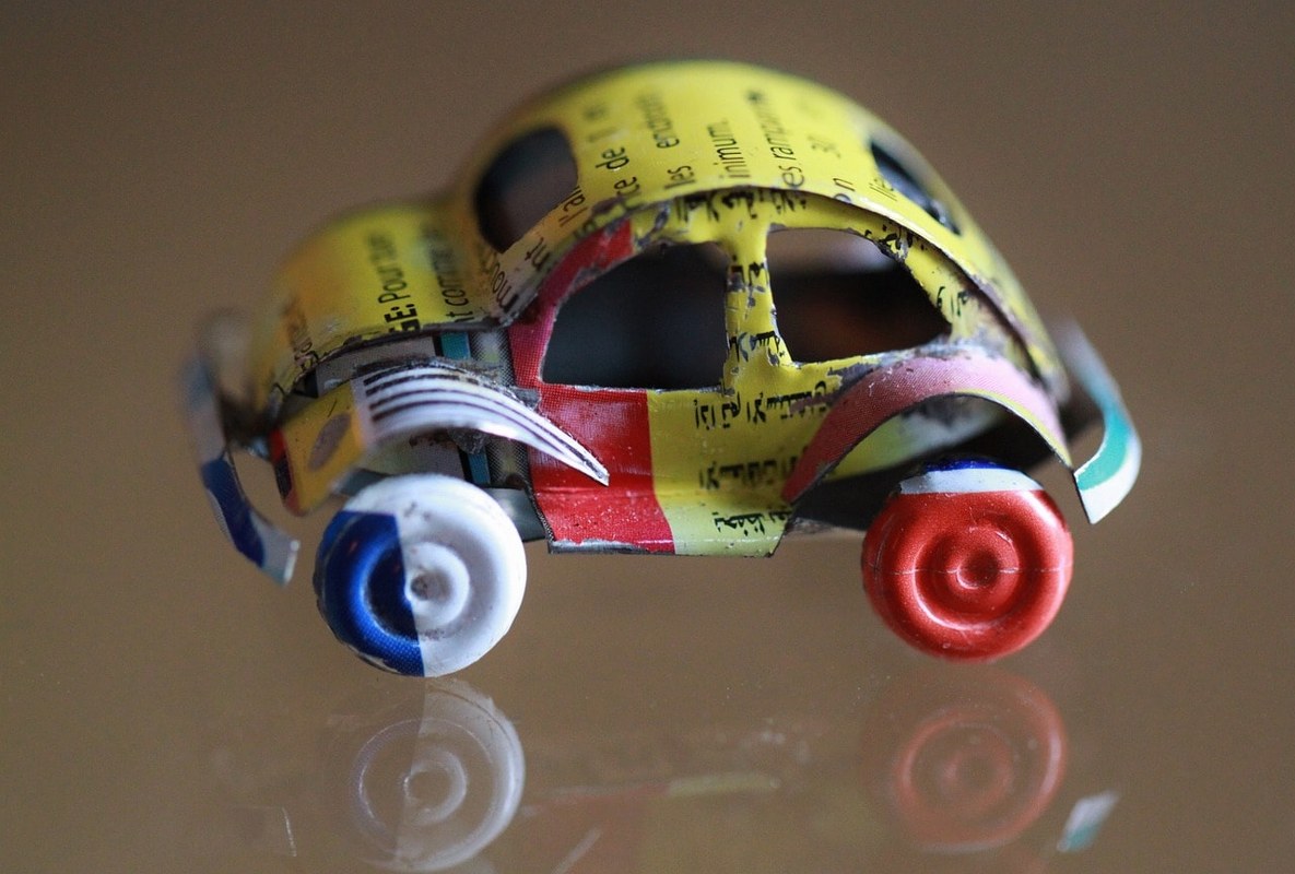 A toy car made out of recyclabe material.