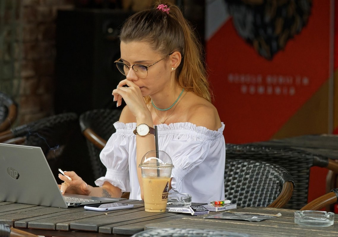 A woman buying something online with her laptop.