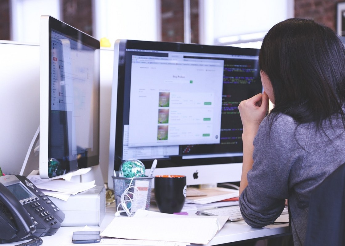 A woman conducting marketing research on the internet.