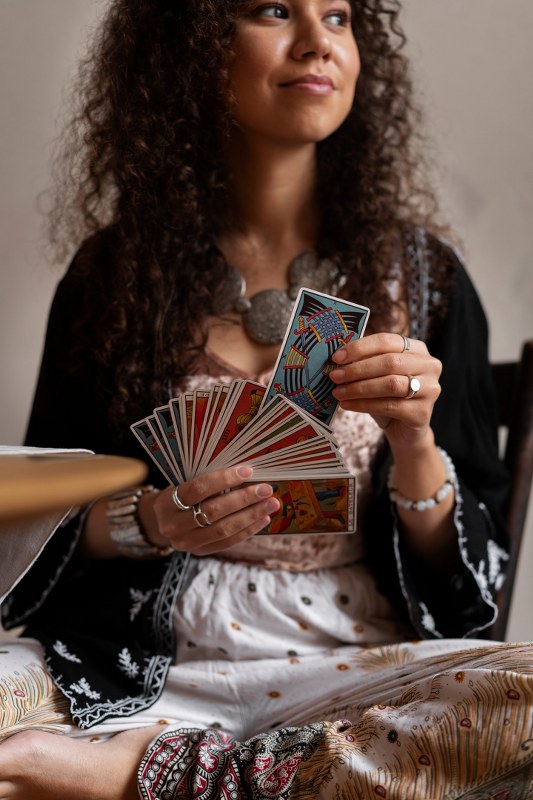 A woman shuffling cards.