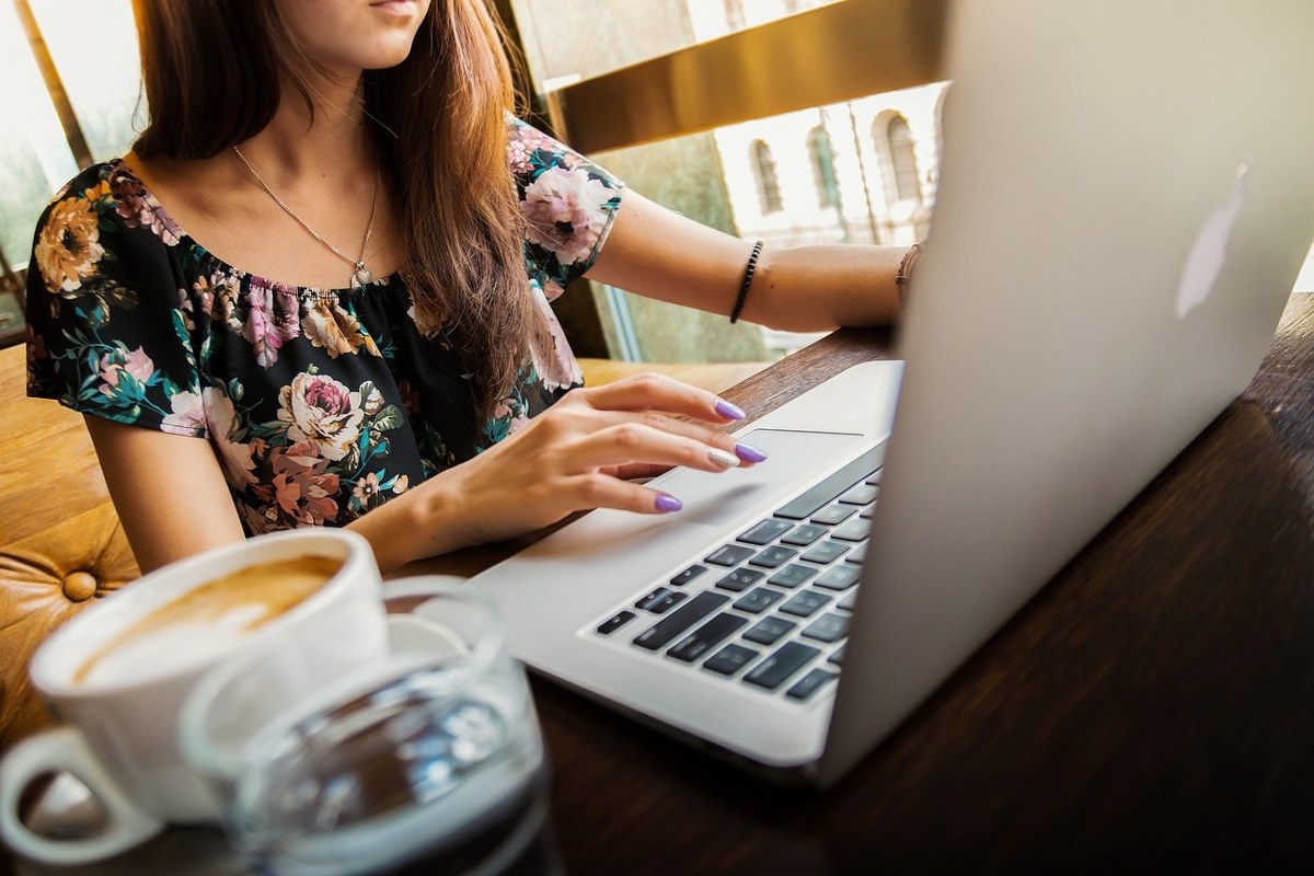 A woman working on her laptop.