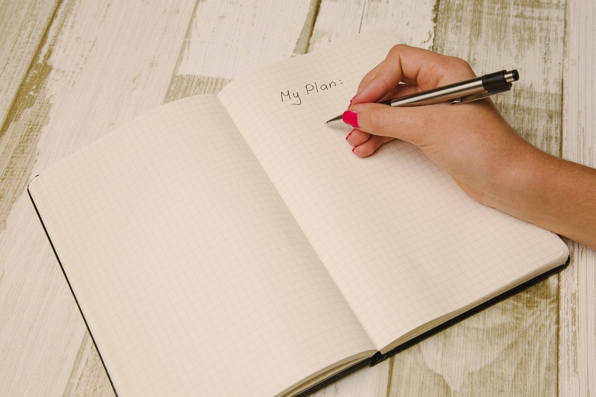 A woman writing her plan and strategy.