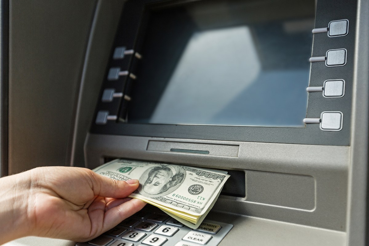 ATM maching dispensing out money.