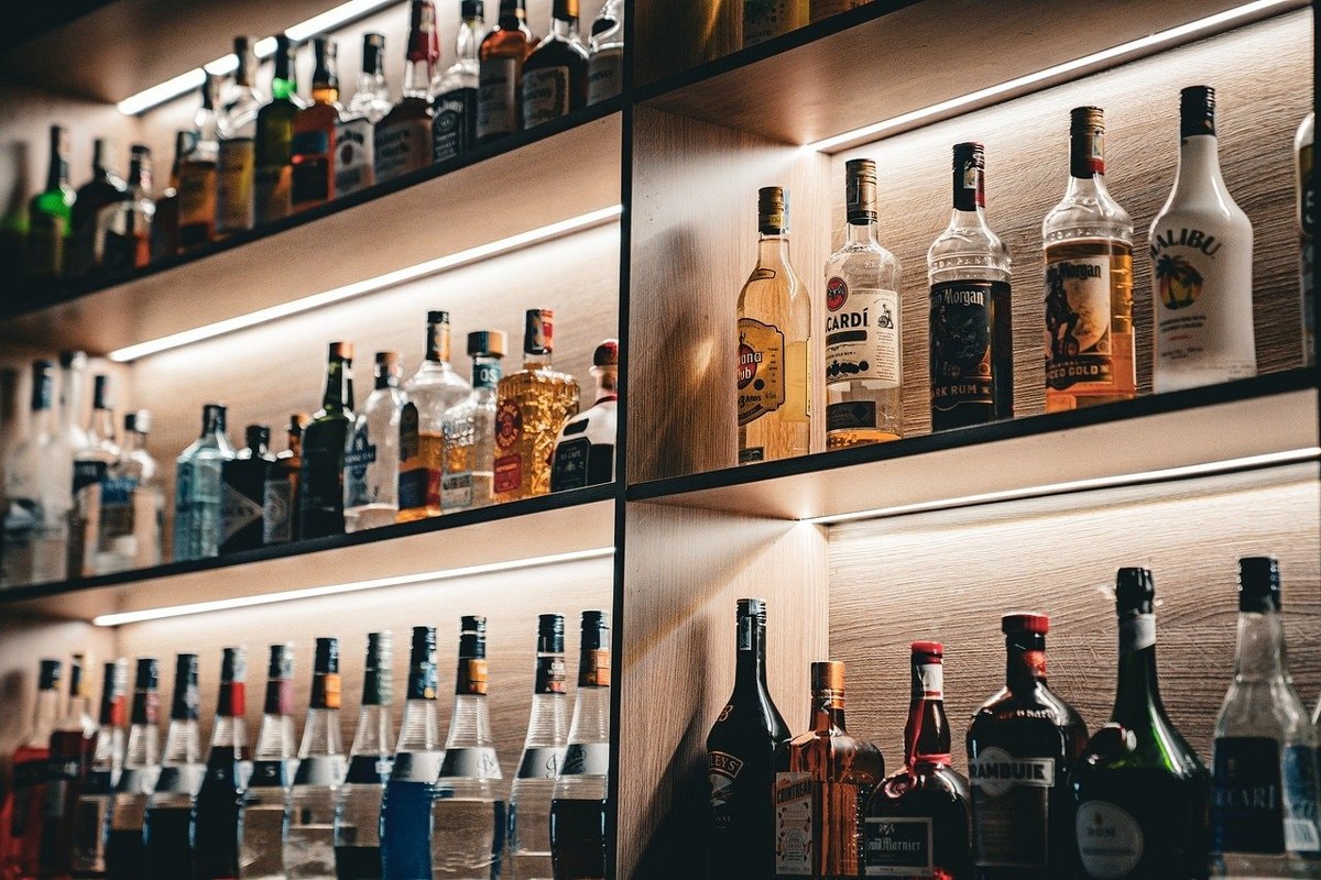 Alcoholic drinks on a shelf.