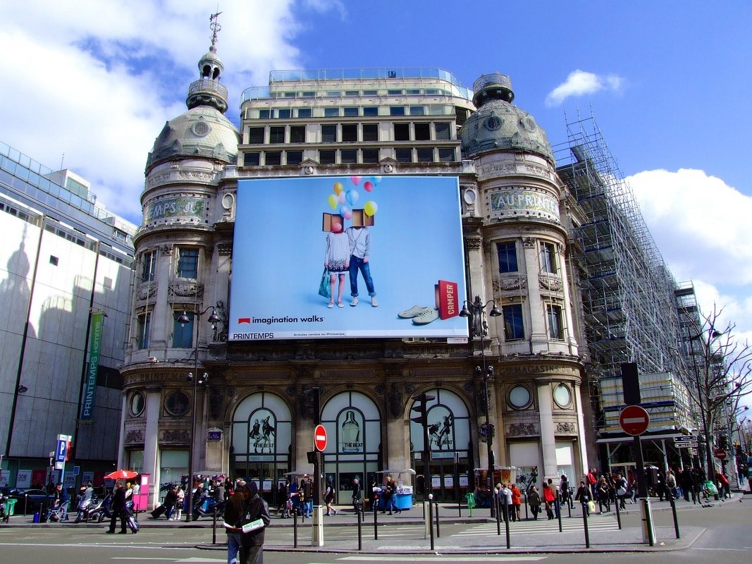 An advertisement on a building in Paris.