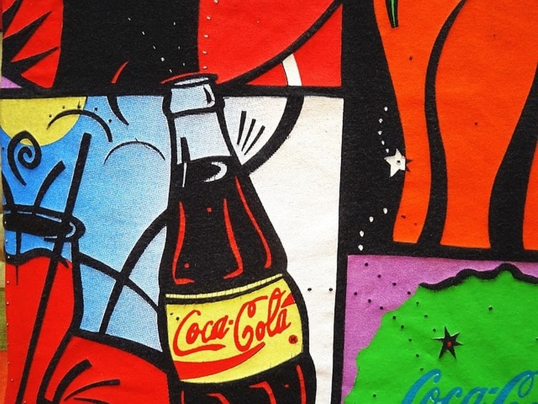 An artistic painting on a wall - Coca Cola bottle.