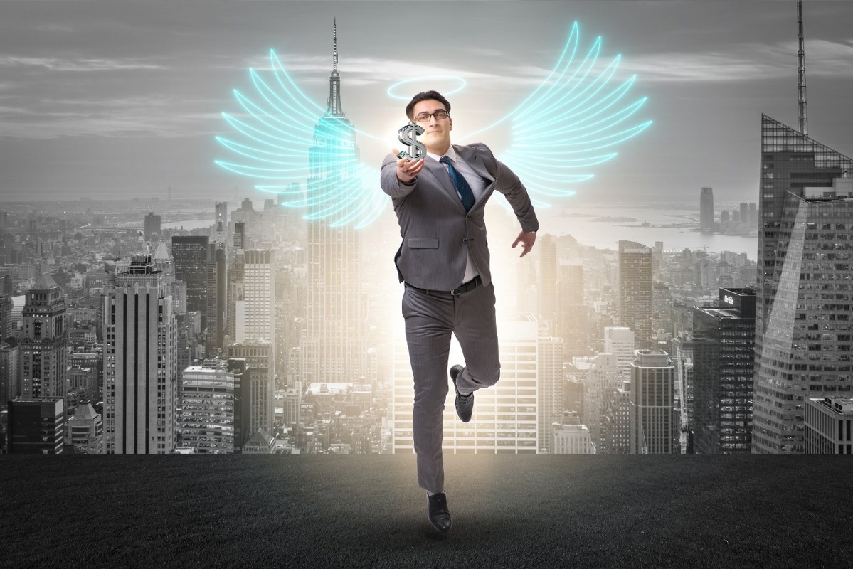 Angel Investor Concept: Businessman with Wings.