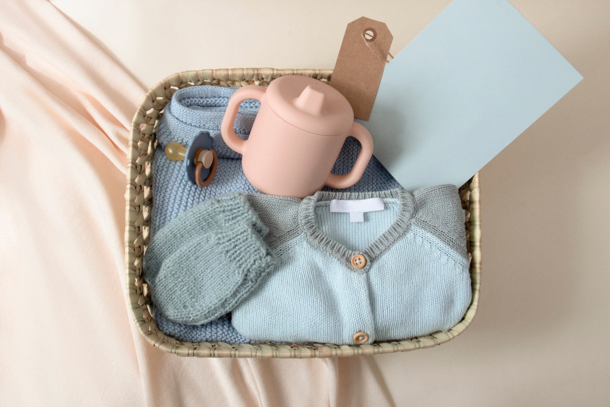 Baby clothes and feeding set bundled up.
