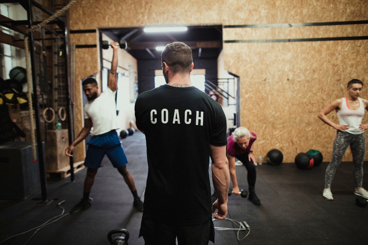 Backview of coach Instructing Fitness Class.