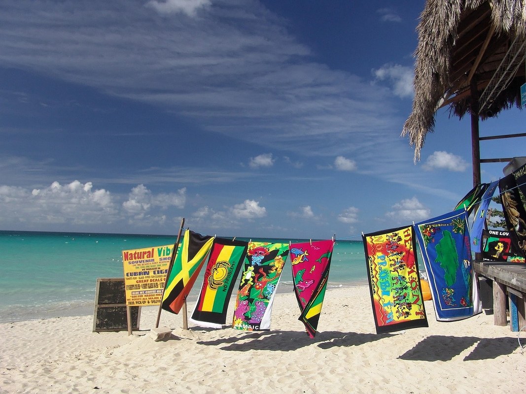 Beach towels hanged on a beach in the afternoon.