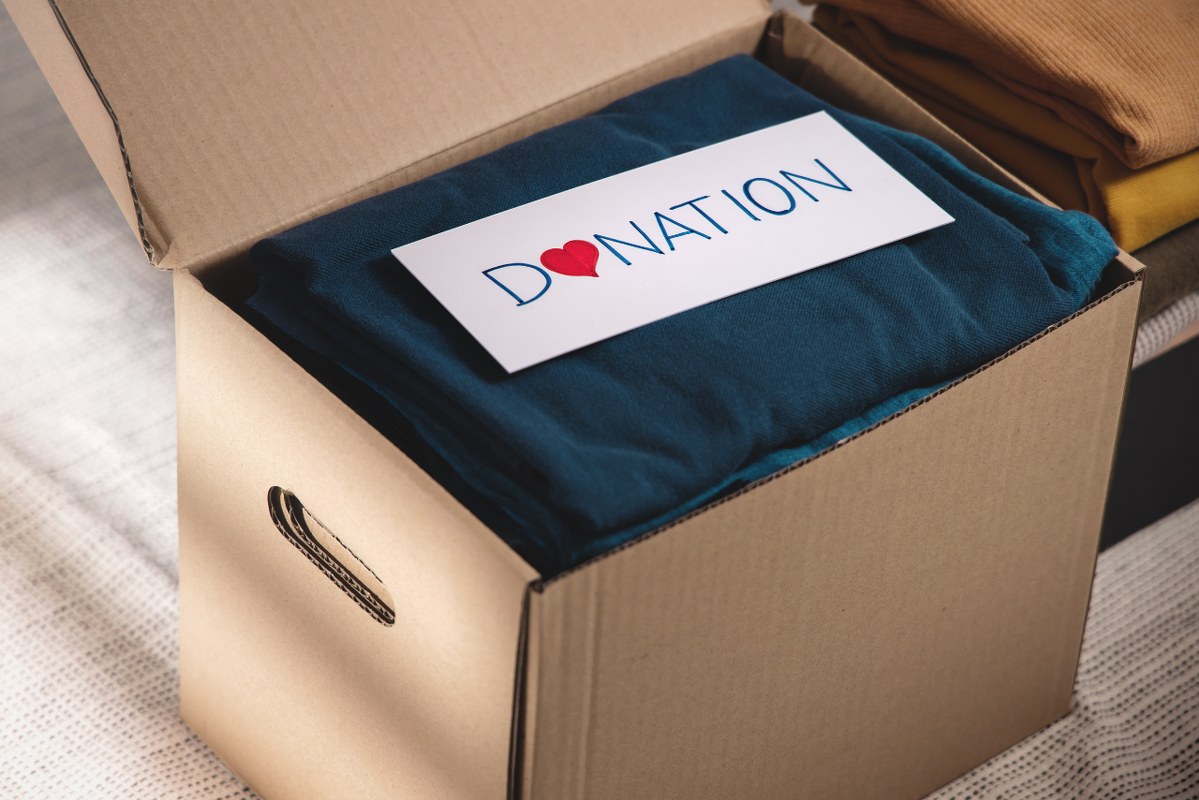 Box of Clothes with Donation Label.
