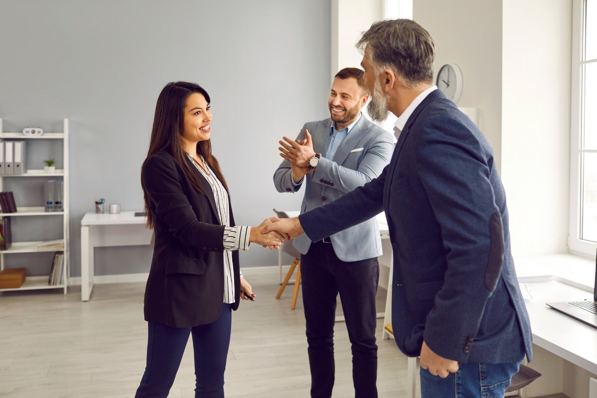 Business Team Showing Appreciation to a female client.