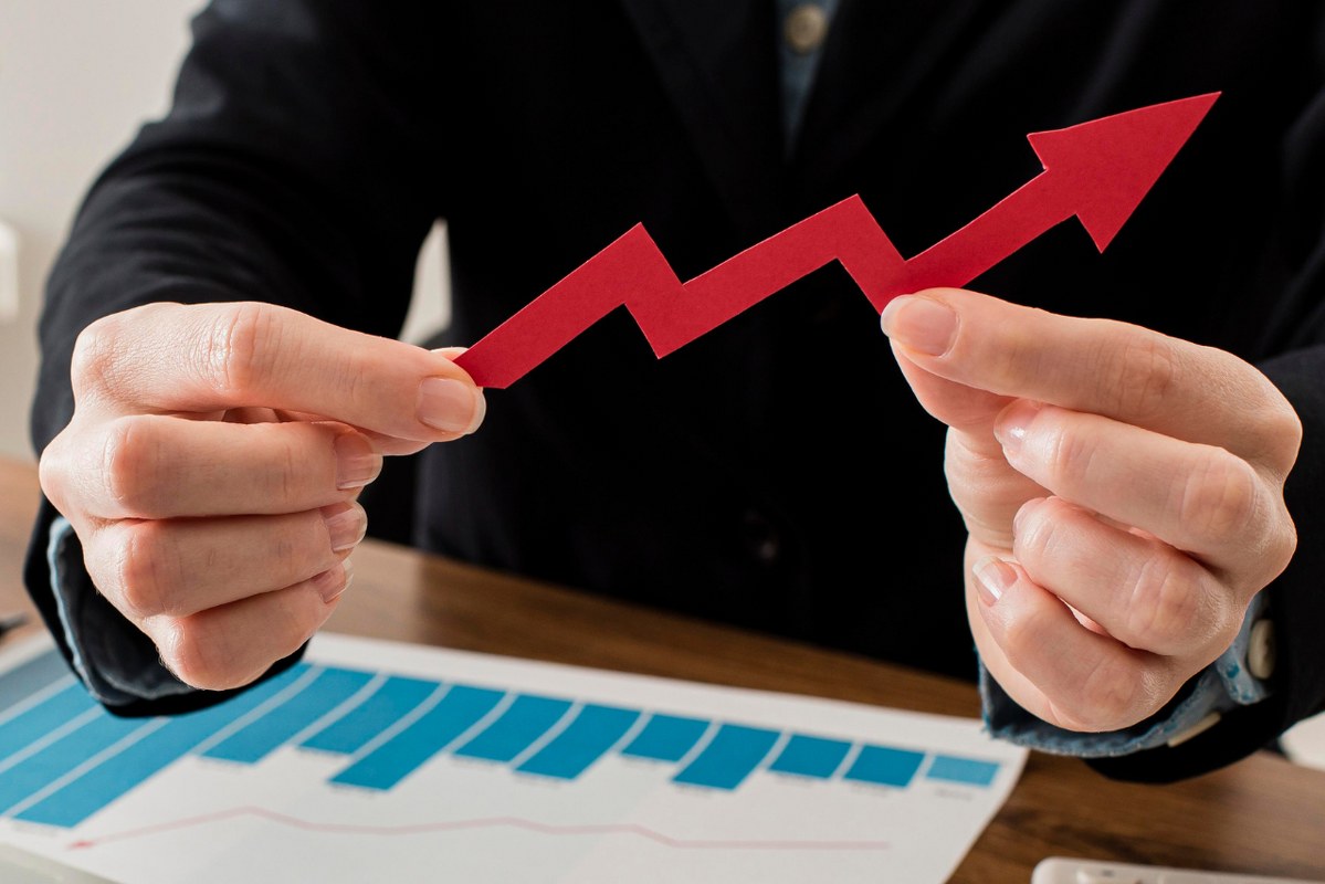 Businessman Holding Growth Arrow.