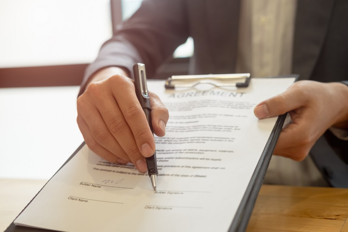Businessman Reaching Out a Document with partnership Agreement.