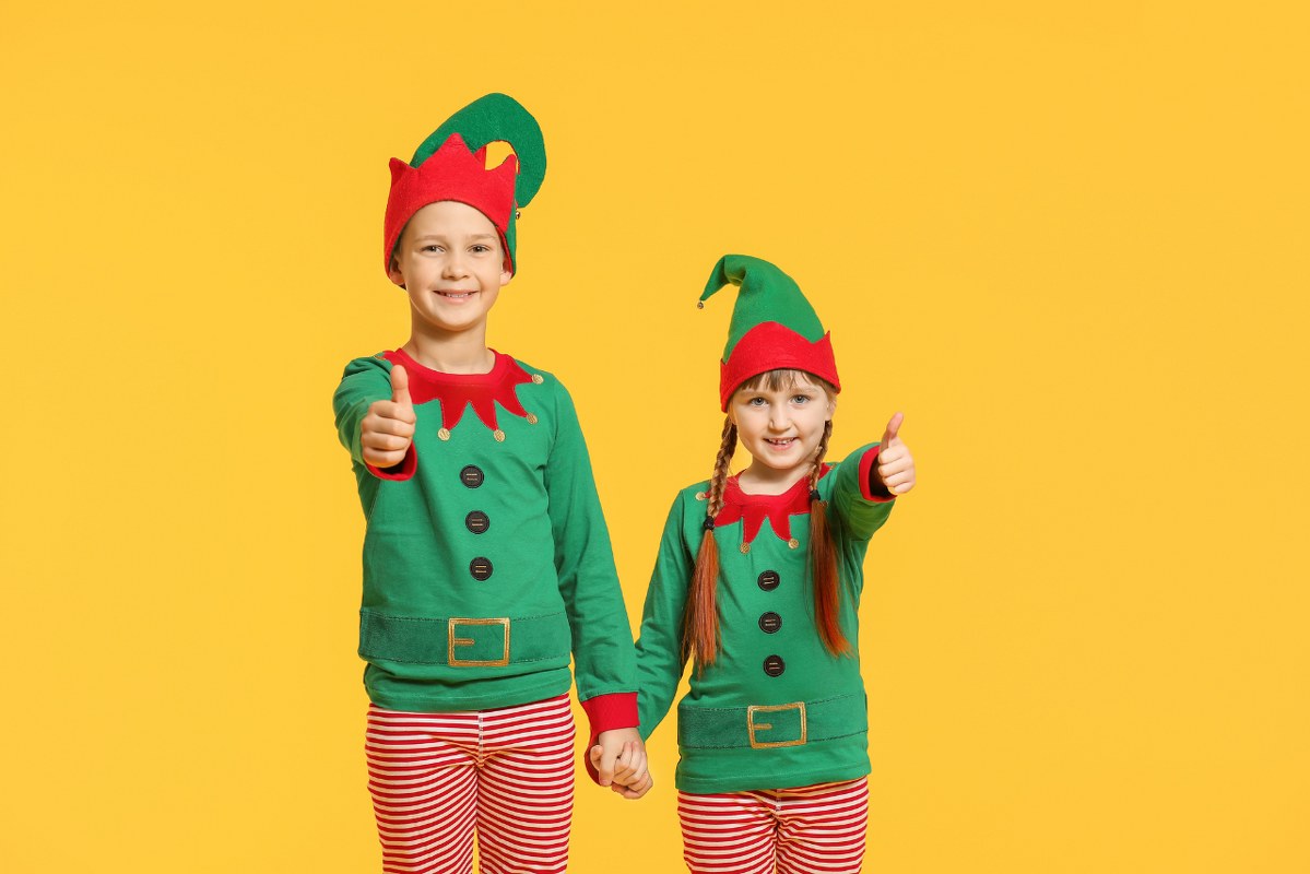 Children in Costume of Elf Showing Thumb-up Gesture