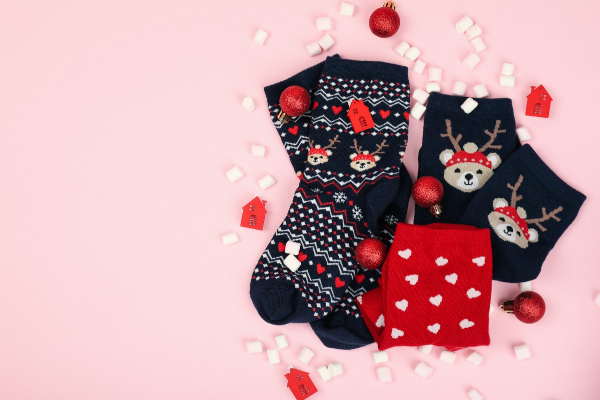 Christmas socks on pink background.