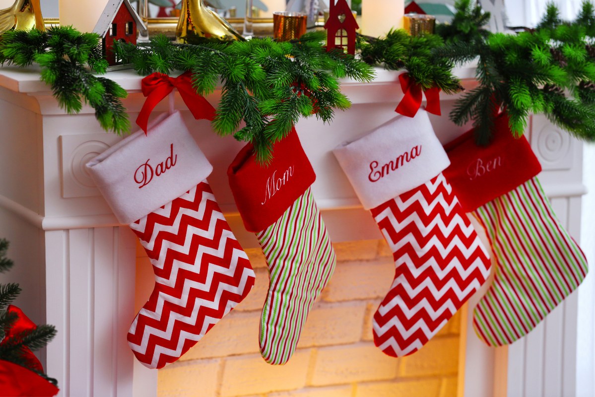 Christmas stockings hanging on fireplace.