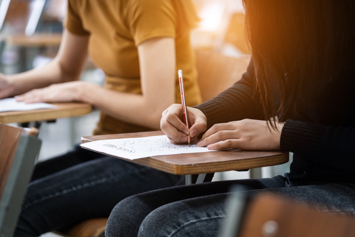 Close-up of students taking exam.