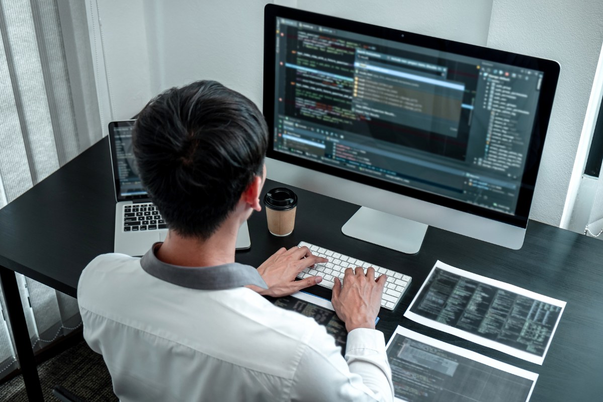 Computer Programmer Coding and Creating a website.