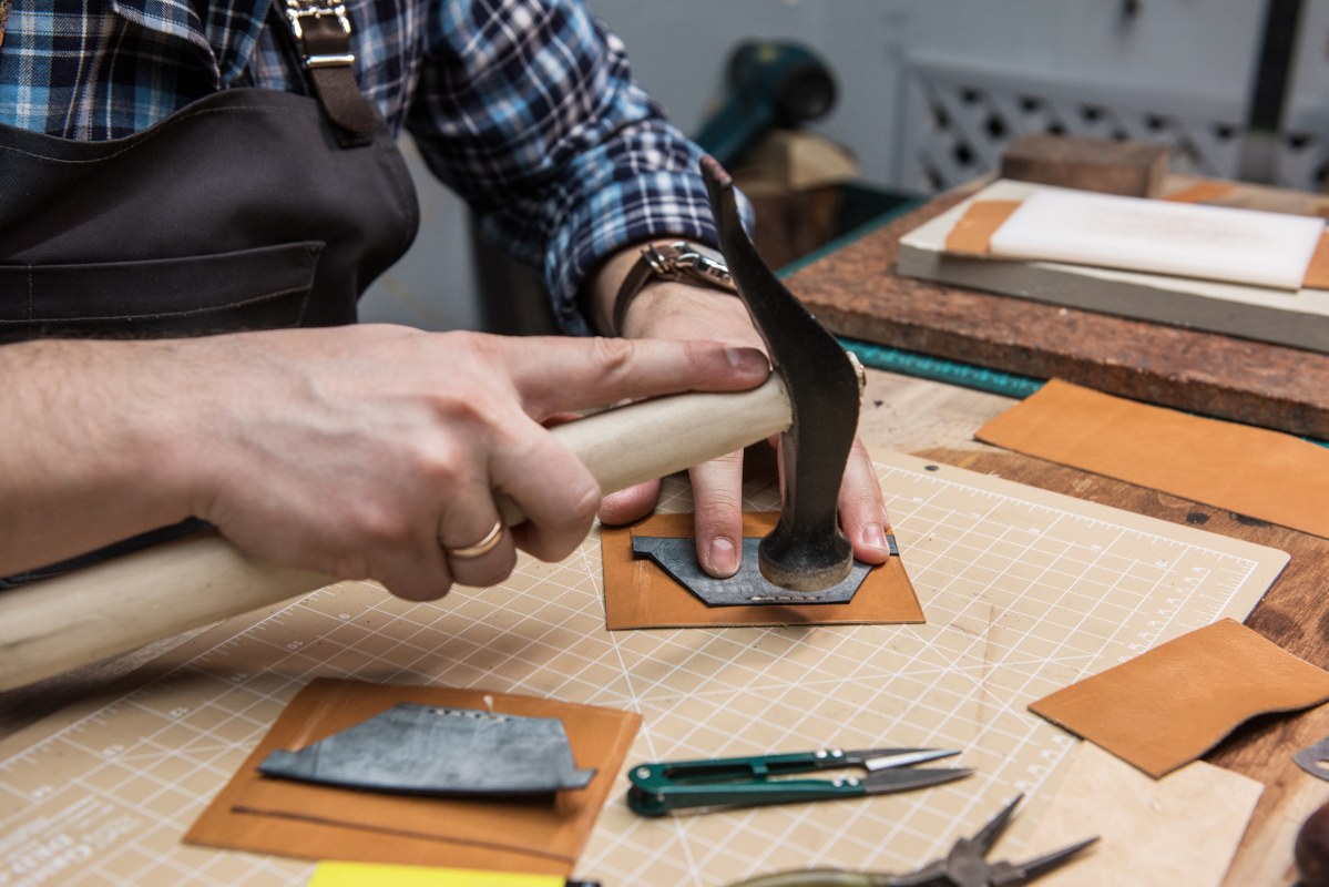Concept of handmade craft production of leather goods.