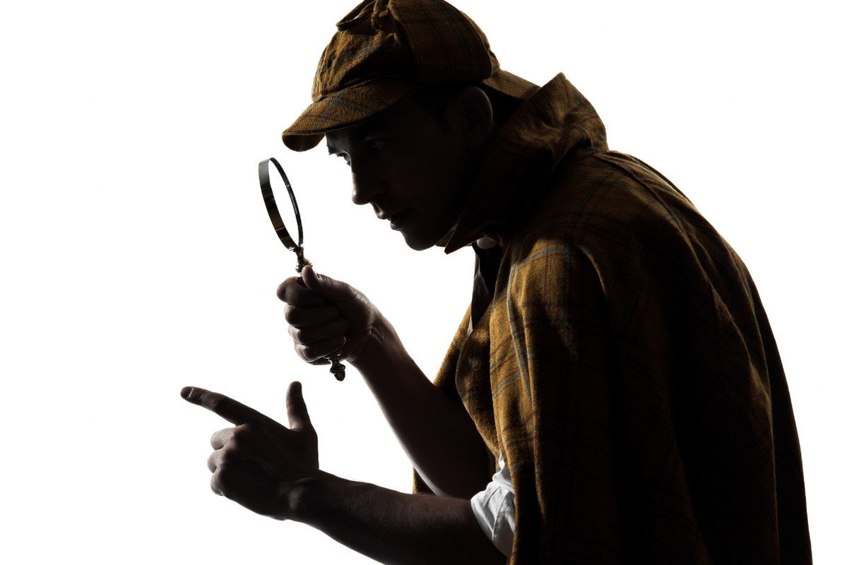 Detective silhouette finding clues.